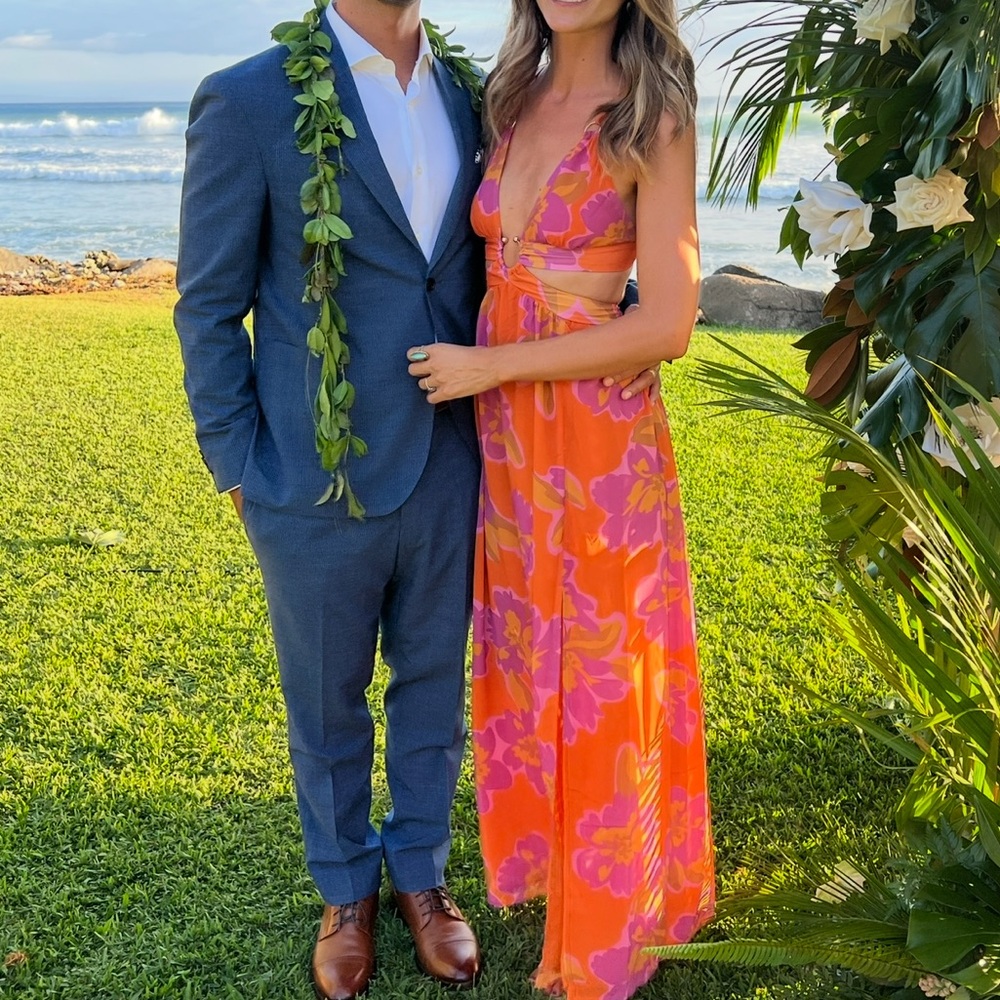 Tropical wedding guest dress with orange and purple flowers and cut outs